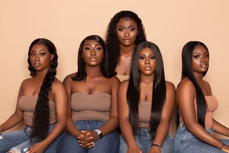 A group of women showcasing different hair textures and personal styles